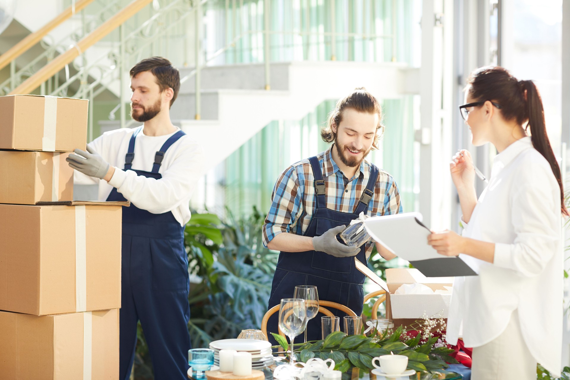 Female manager making notes in report while taking delivery